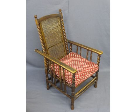 VINTAGE RECLINING ELBOW CHAIR with cane seat and back, bobbin and twist detail