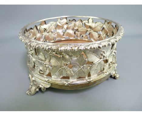 WILLIAM IV SILVER WINE COASTER, Maker Henry Wilkinson &amp; Co openwork fruit and vine work, raised on three feet with mahoga