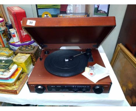 A retro unbranded wooden cased record player radio 44cm x 35cm x 13cm