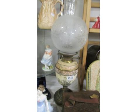 An old oil lamp with pottery font. COLLECT ONLY.Hole drilled in the pottery base, front stack firm in urn base. When viewed i