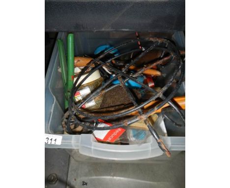 A box of tools, paint brushes, grease gun etc.,