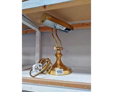 A brass bankers desk lamp