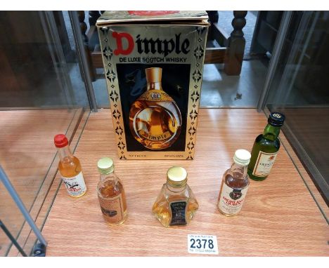 A boxed Dimple deluxe Scotch whisky and 5 miniatures.