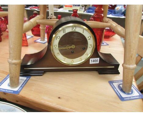 A Hermle chiming mantel clock.
