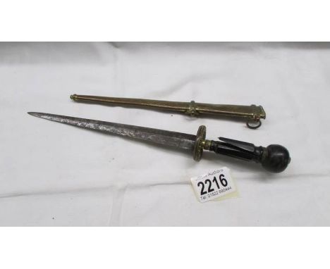 A Victorian dagger in sheath (damage to handle).The handle is etched but difficult to see due to rust/pitting. Blade 19.5cm, 