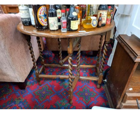 An oak barley twist gate leg table. COLLECT ONLY.