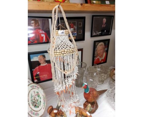 A vintage sea shell wall garden hanging