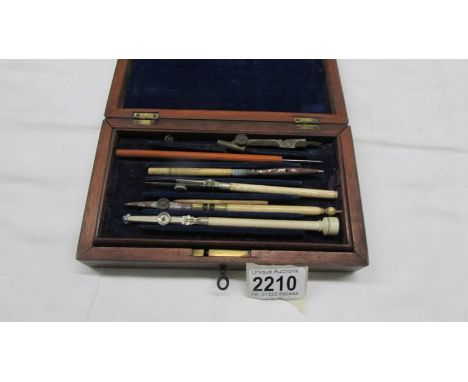 A cased part geometry set with bone handles.