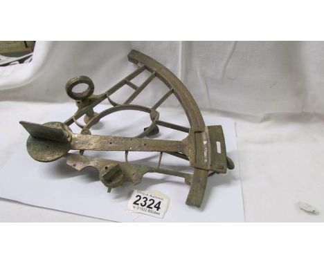 An antique brass sextant (metal detector find).