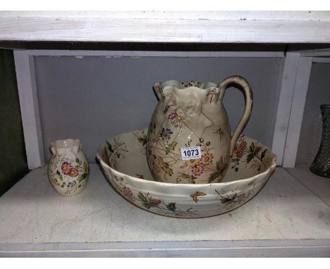 An Edwardian wash jug and basin plus a toothbrush pot