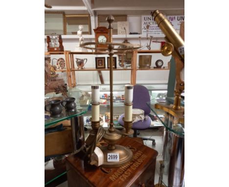 A brass double light table lamp.