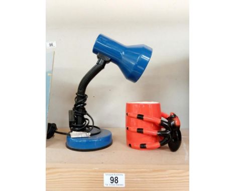 A reading lamp and spider mug