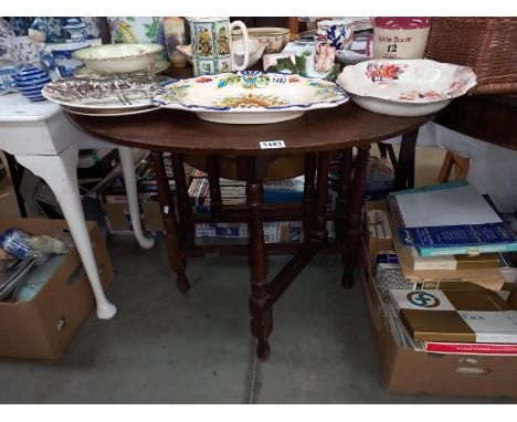 An oak gate leg table. COLLECT ONLY.