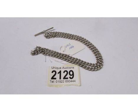 A silver curb chain with vintage T bar.