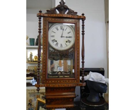 A good quality mahogany inlaid wall clock in good condition but missing pendulum, COLLECT ONLY.
