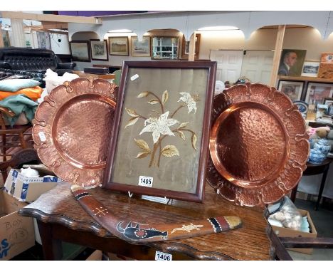 A pair of hammered copper plates, an original boomerang &amp; a period embroidered flower picture