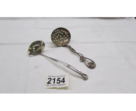 A silver sifter spoon and a small Danish silver ladle, 50 grams.