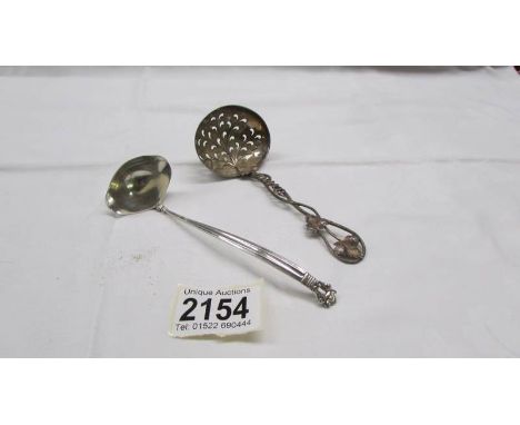 A silver sifter spoon and a small Danish silver ladle, 50 grams.