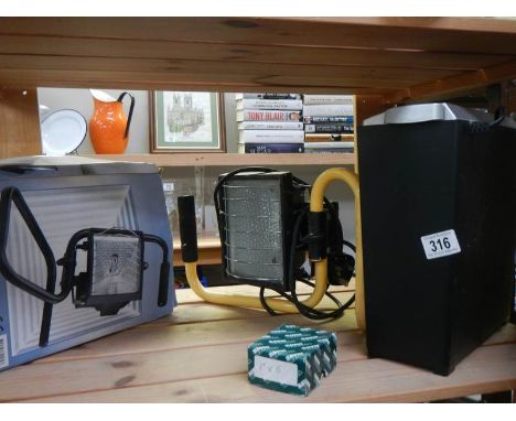 A halogen lamp, a paper shredder and a garden lamp. COLLECT ONLY.