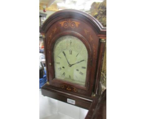 A mahogany inlaid 8 day bracket clock in working order.