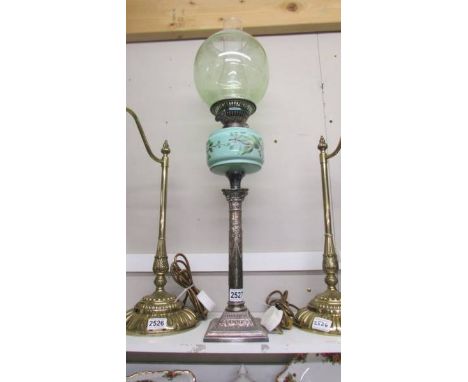 A silver? based column oil lamp with green glass font. COLLECT ONLY. The base has no drill holes and looks to be in good cond