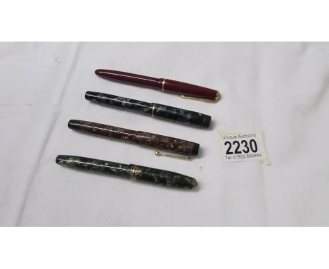 A Parker pen, a Conway Stewart pen, A Mentmoke pen and another Parker pen all with 14ct gold nibs.