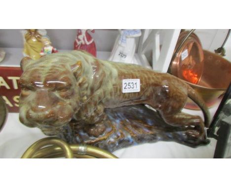 A ceramic figure of a tiger. COLLECT ONLY.