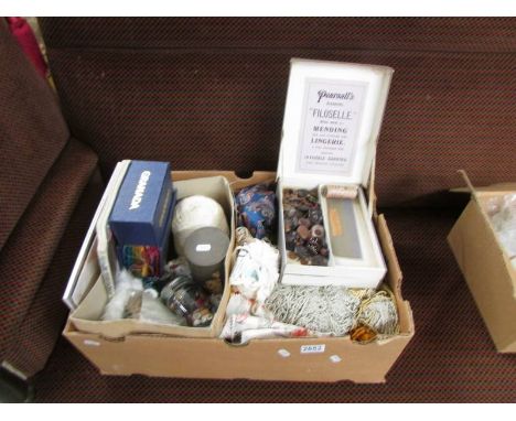 A box of haberdashery including vintage knitting patternsm&nbsp; knitting needles, fabrics, buttons, trims etc.,