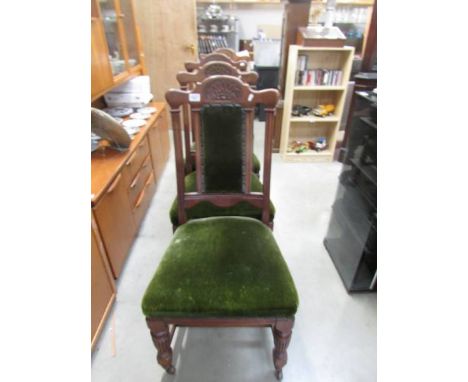 A set of four pillar back and carved dining chairs with green upholstery, COLLECT ONLY.