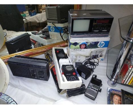 A pair of Artlight walkie talkies, vintage Saisho tv, digital alarm clock etc