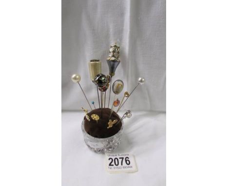 A collection of hat pins and tie pins.