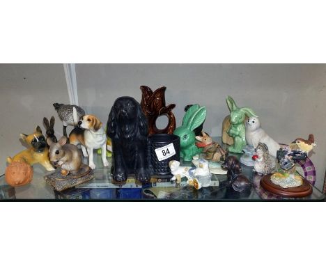 A quantity of animal ornaments including Sylvac rabbits, spaniel planter etc