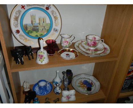 A mixed lot of ornaments, plates, cups, saucers, jug etc., 2 shelves. COLLECT ONLY.