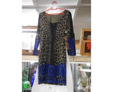 A leopard print designer dress (no makers labels)