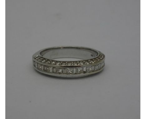 An 18ct white gold and diamond ring, set with fifty-eight diamonds, one diamond missing, weight 5.2g, size N