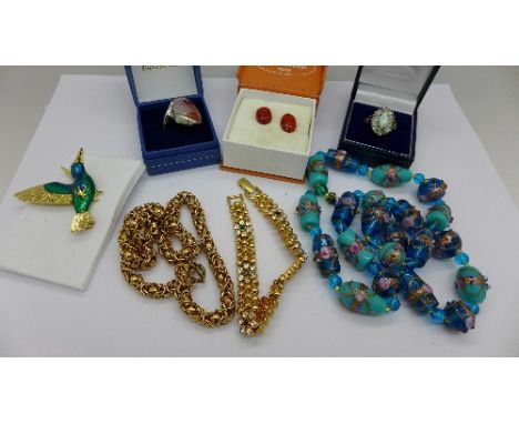 A silver and synthetic opal ring, amber earrings, a bead necklace, a bracelet, etc.