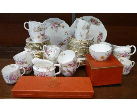 A collection of Royal Crown Derby, Derby Posies tea ware including eleven tea cups and thirteen saucers, five coffee cans and