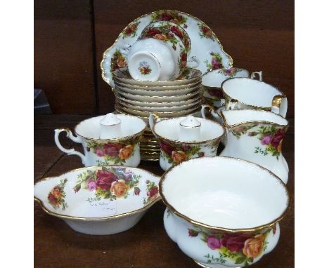 A Royal Albert Old Country Roses eight setting tea service, with sandwich plate, cream and sugar, two peppers and a dish, thi
