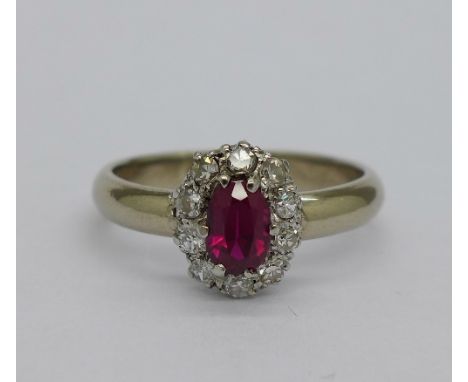 A white metal set 18ct gold, diamond and ruby cluster ring, weight 4g, size M