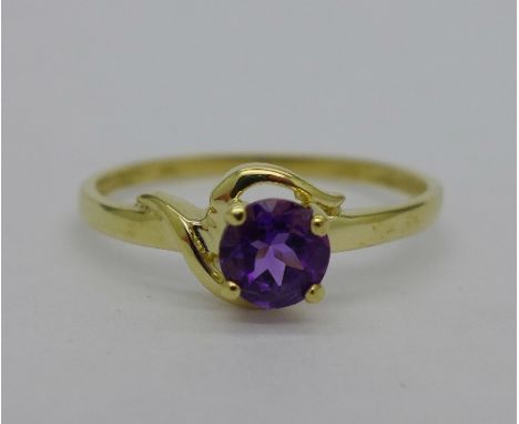 A 9ct gold and purple stone ring, weight 1g, size O