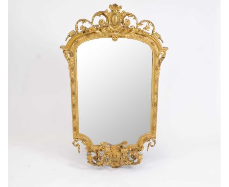 A highly decorative 19 th century gilt framed girandole, in the Chippendale style, decorated with moulded borders, surmounted