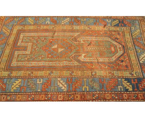 A Caucasian rug, with a central arrow-form medallion and arrowhead border, within three borders with geometric motifs, 177 x 