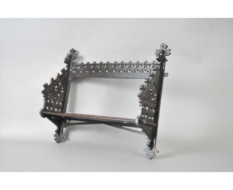 A small Victorian stained and carved wall-hanging book shelf, with pierced detail throughout, in the Gothic style, 50 cm wide