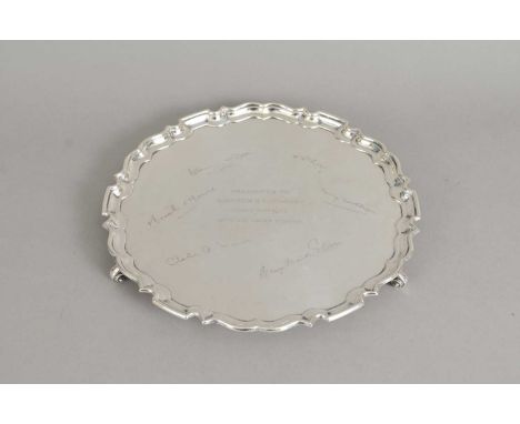 A presentation silver salver, Frank Cobb &amp; Co Ltd. Sheffield 1944, of circular form with pie crust rim, engraved central 