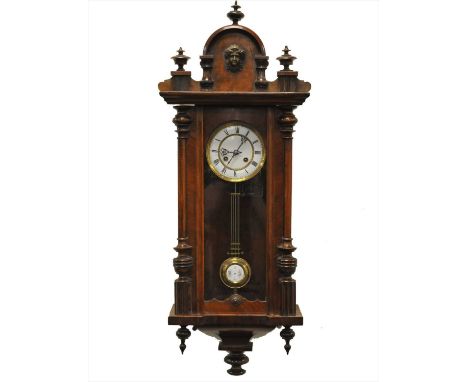 A walnut cased Vienna wall clock with black Roman numerals and a white enamelled dial and 8-day spring-driven movement, set i