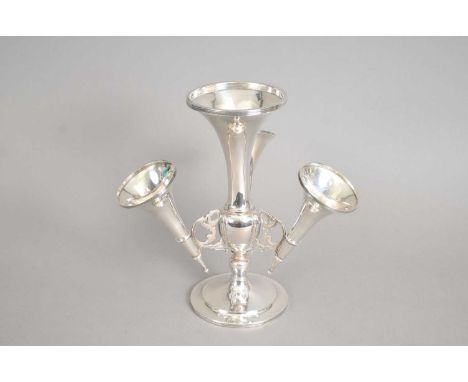 A silver mounted epergne, makers mark rubbed, Birmingham 1911, the central tapering vase issuing three trumpet branches, rais