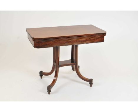 A William IV mahogany folding card table, the rounded plain sliding top raised on four swept legs, united by a platform stret