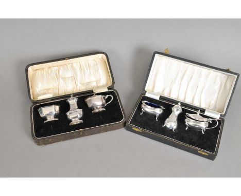 A cased set of three silver cruets, Henry Matthews, Birmingham 1928 and 1929, together with a further cased set of three silv