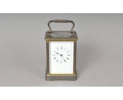 A French brass-cased carriage clock, with black Roman numerals on a white dial, engraved Aiguilles to the back, 13 cm high.