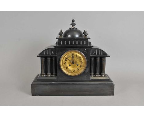 A large 19th century French slate cased mantle clock, with black painted Arabic numerals on a gilded dial, in a classically p